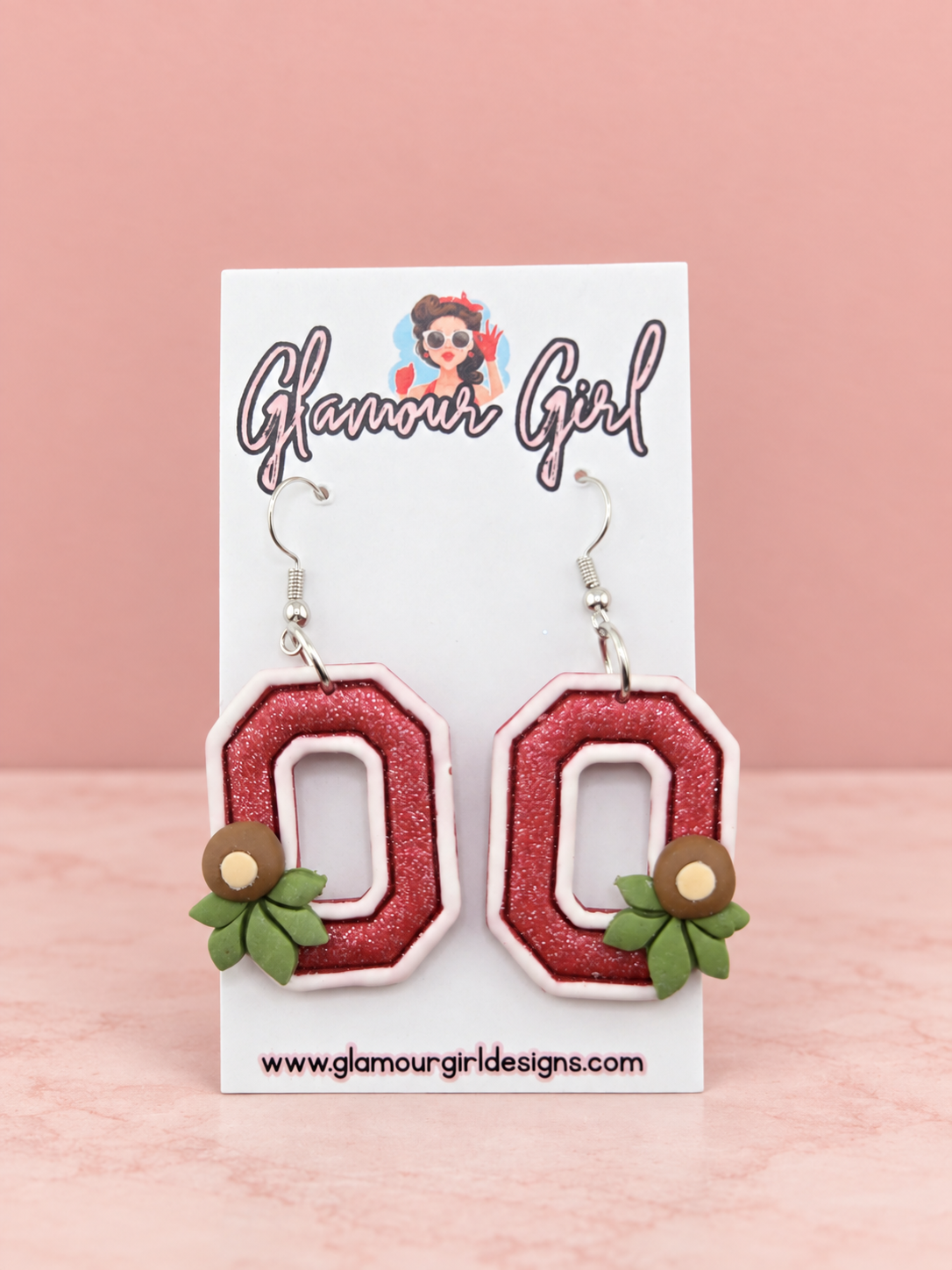 Scarlet Buckeye Block O earrings alternate view on blush pink background