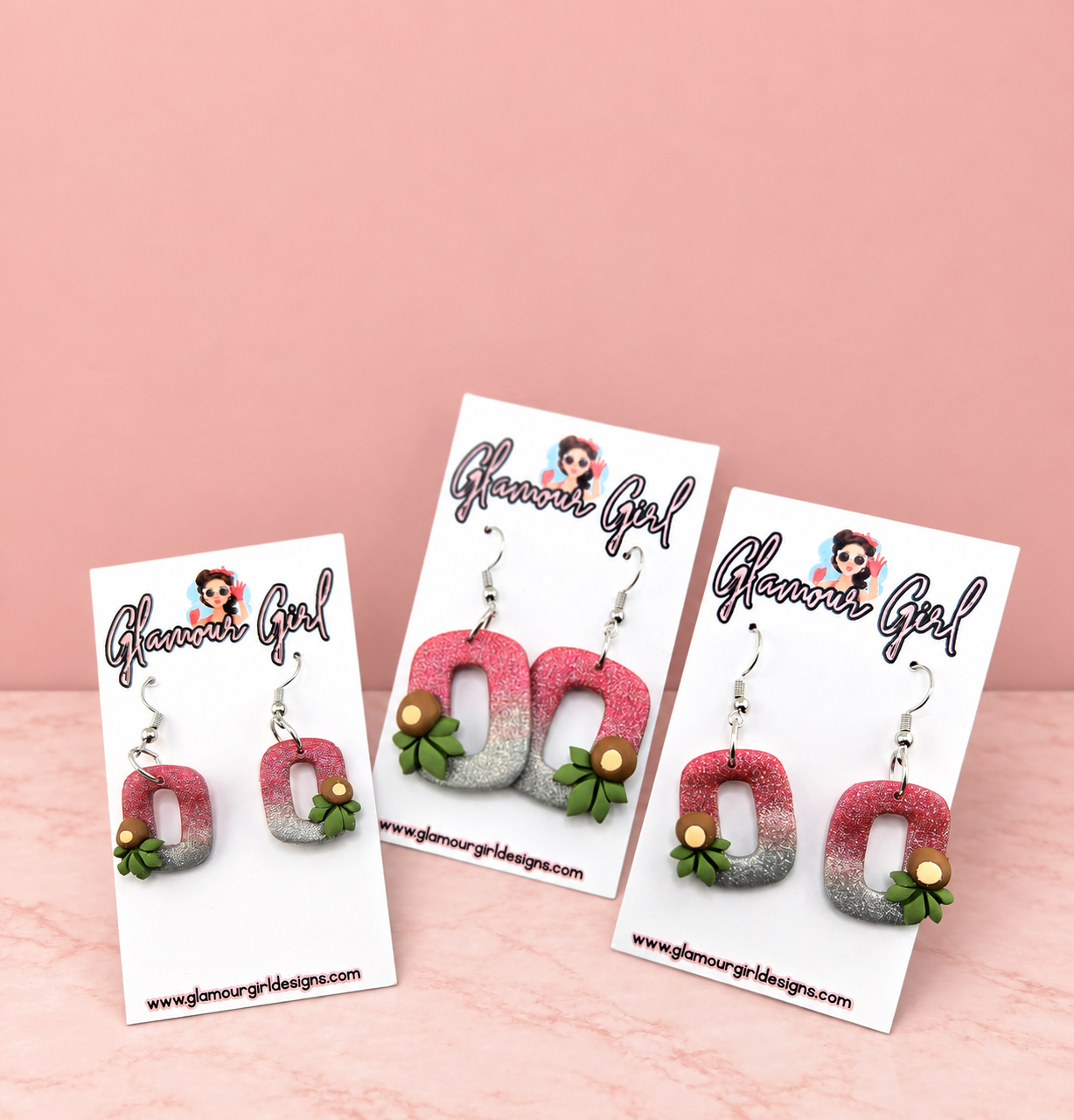 Buckeye helmet earrings group view on blush pink background